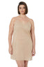 Woman wearing a beige slip dress on a white background