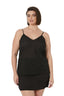 Woman wearing a black slip dress on a white background