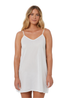 Woman wearing a white slip dress on a white background